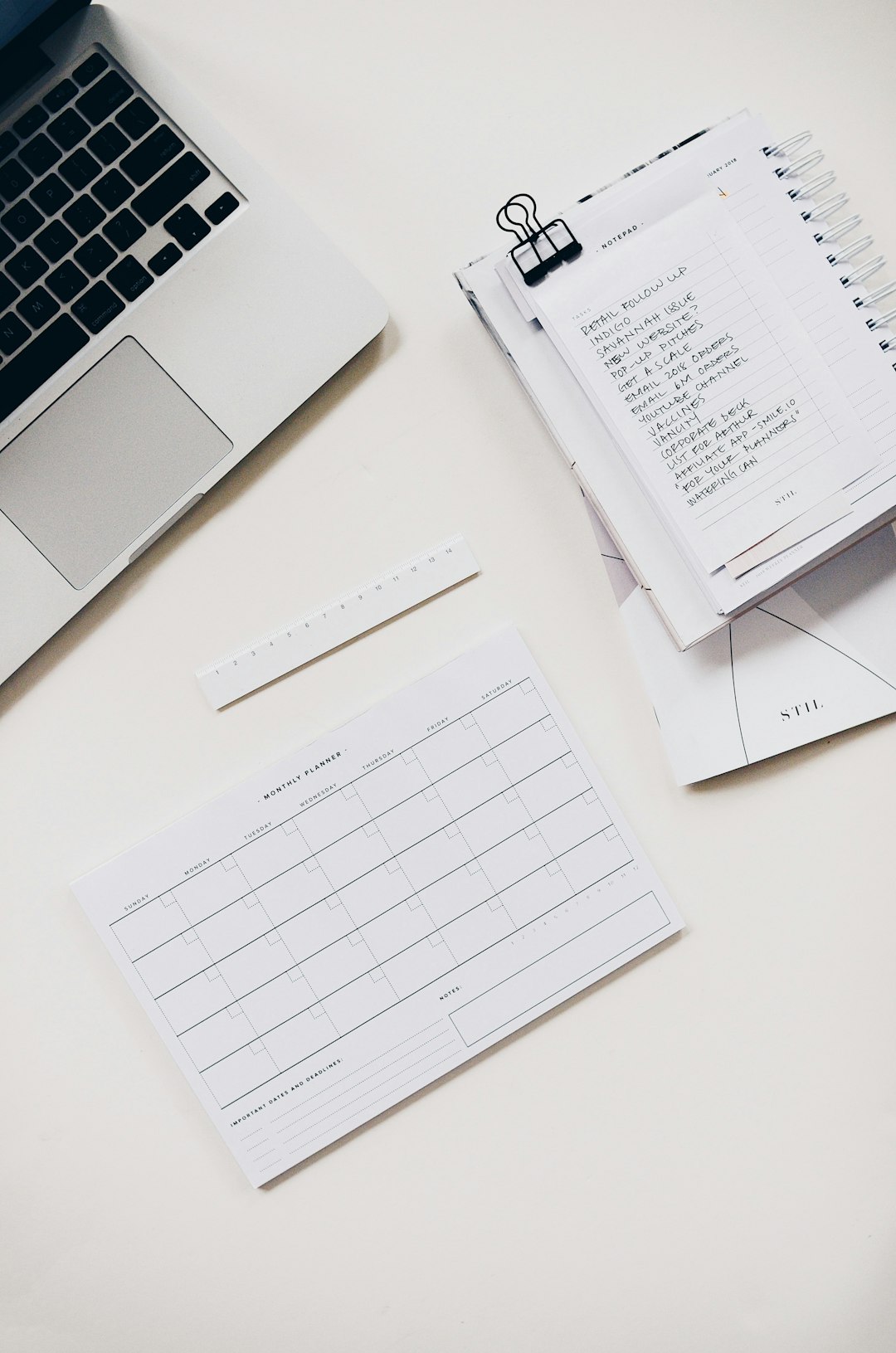 To-do list with notebook and laptop