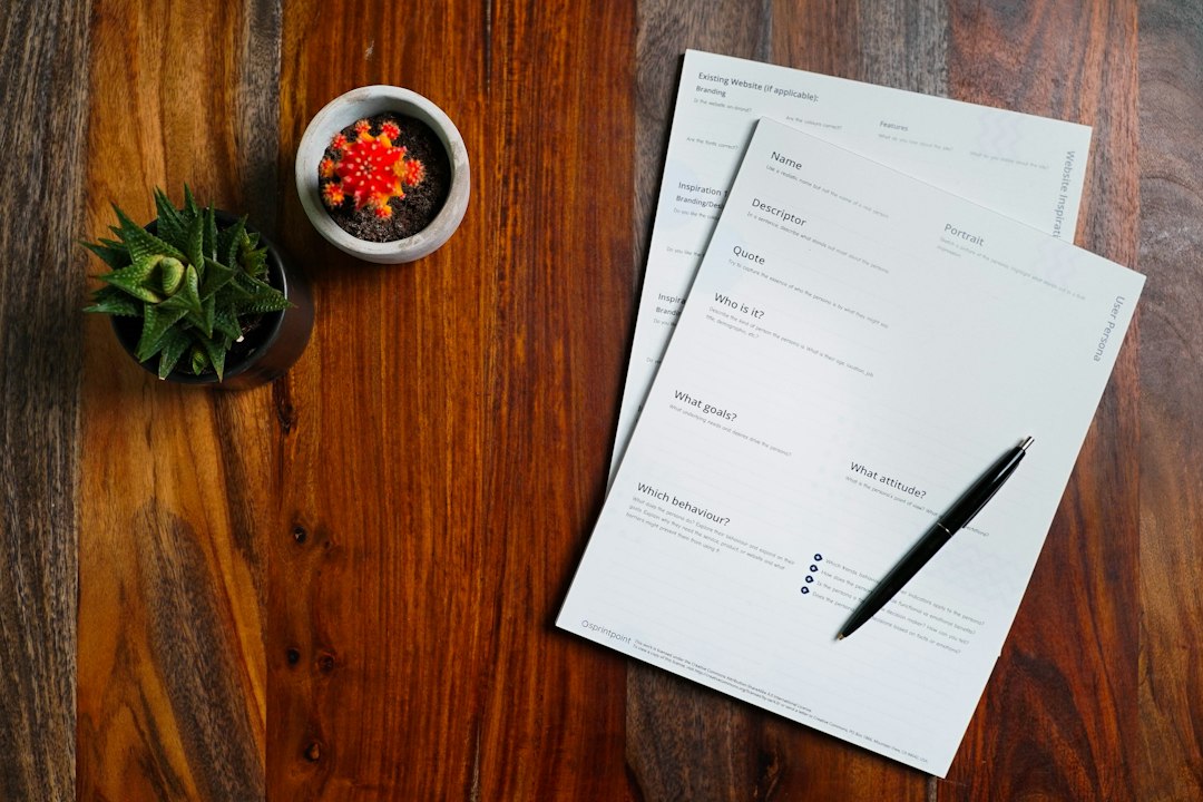 Documents and pen on a desk — assembling the evidence file
