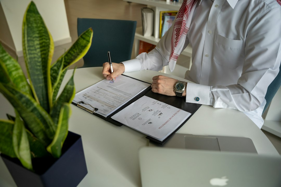 Coordinator documenting processes at a desk